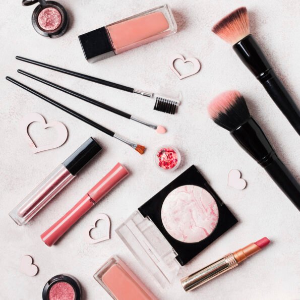 lay out make up cosmetics decorated with hearts